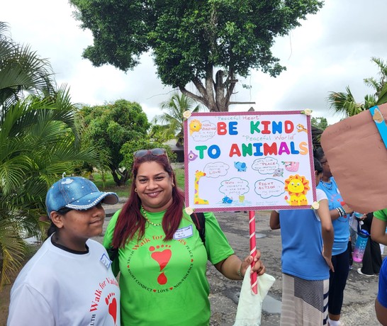 West Indies Walk for Values Volunteer With Sign 02