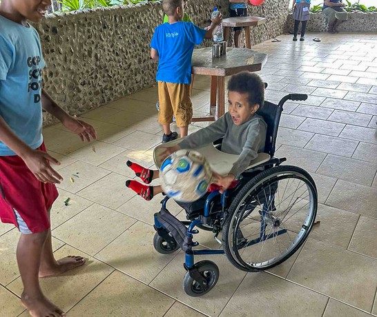 Fiji 04 Kids Fun Day Wheelchair With Soccer Ball