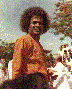 Sathya Sai Baba, with people in background